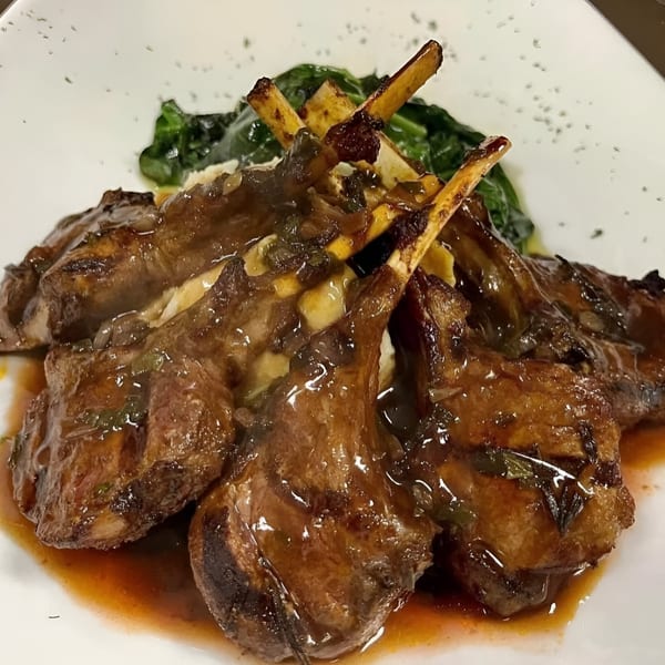 Terra Ristorante & Bar's lamb chops with sauce, mashed potatoes, and green vegetables.